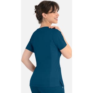 A women's curved mock wrap top in teal, featuring short sleeves and a fitted design, with a logo on the back.