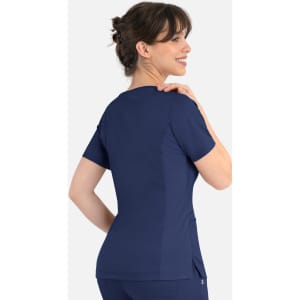 A navy women's curved mock wrap top with short sleeves and a side pocket, featuring a branding logo.