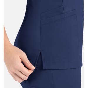 A navy women's curved mock wrap top featuring pockets and side slits for added comfort and style.