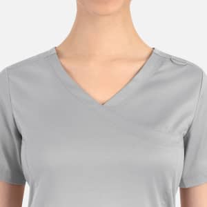 A grey women's curved mock wrap top featuring a v-neckline and a single button detail on the shoulder.