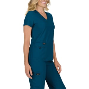 A scrub top in teal with a v-neck and two front pockets, paired with matching scrub pants. The outfit has a logo.
