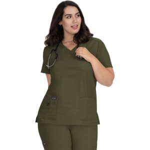 A green medical top featuring short sleeves and side pockets, worn by a model with a stethoscope around her neck.