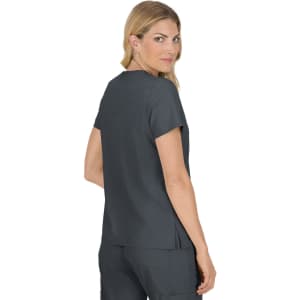 A woman wearing a dark grey top with short sleeves, viewed from the back, featuring a split hem design.