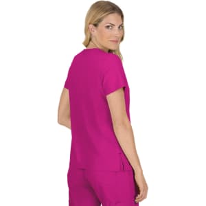A pink medical top with short sleeves, featuring a relaxed fit and a split hem at the back.