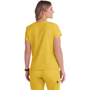 A yellow top with short sleeves, featuring a simple design and a logo on the back.