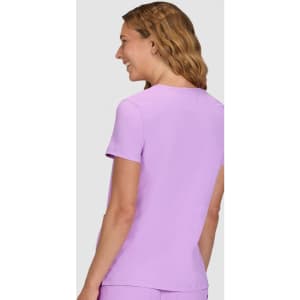 A lilac short-sleeve top with a round neckline, featuring a smooth fabric and a logo on the back.