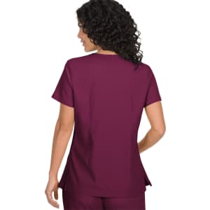 A maroon medical top with short sleeves, featuring a tailored cut and slight side slits. It has a logo on the back.