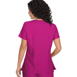 A top in a vibrant pink colour with short sleeves and a relaxed fit, featuring a logo.