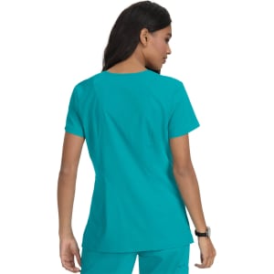 A teal medical scrub top displayed on a model from the back, featuring a logo on the garment.