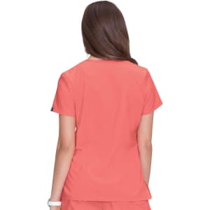 A coral-coloured top with short sleeves, shown from the back, featuring a logo on one sleeve.