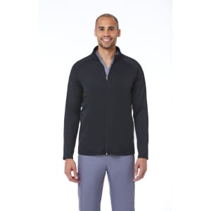 A black men's warm-up fleece jacket with a zip front and a logo displayed. The model is wearing grey pants.