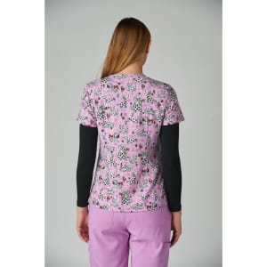 A floral patterned top in shades of pink with black details, worn with black long sleeves underneath.
