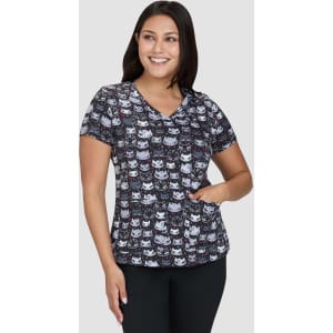 A top featuring a multicoloured pattern of cartoon cats on a dark background. It has a V-neck and short sleeves.