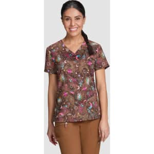 A printed brown top featuring vibrant patterns of pink, blue, and green. Includes a logo on the fabric.