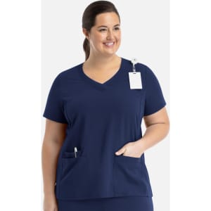 A navy women's layered V-neck top with short sleeves and front pockets, featuring a tag and a logo.