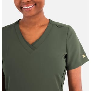 A layered v-neck top in olive green with short sleeves and a subtle logo on the sleeve.