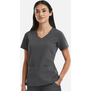 A women's curved V-neck top in grey, featuring short sleeves and side pockets. The top has a branding logo.