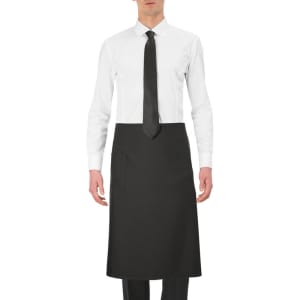 A black apron worn by a person in a white shirt and tie, featuring a side pocket and branding.