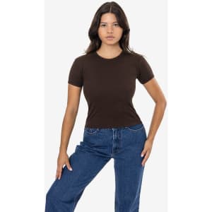 A brown baby rib tee is displayed on a model, paired with blue jeans and set against a plain background.