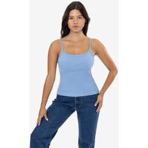 A light blue spaghetti tank top worn by a model, paired with blue jeans, displayed against a plain background.