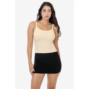 A light beige spaghetti tank top paired with a black mini skirt. The top features thin shoulder straps.
