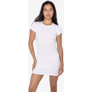 A white cap sleeve garment-dyed baby tee worn by a model, featuring a fitted design and minimal branding.