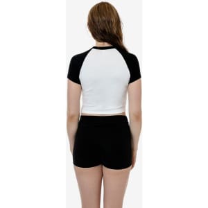 A black and white short sleeve baby rib raglan tee with a fitted design, displayed from the back.