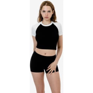 A black and white short sleeve baby rib raglan tee, paired with black shorts, displayed on a model.