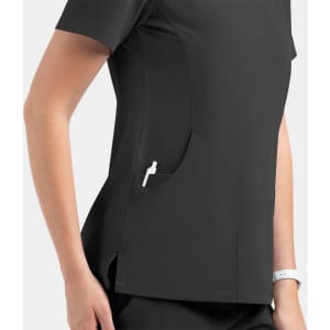A women's black v-neck top featuring a side pocket, made from a lightweight material. Includes a logo.