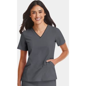 A women's grey V-neck top featuring a contrast design, displayed on a smiling model with a logo on the sleeve.