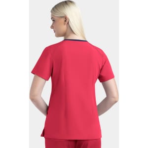 A women's v-neck top in bright red with short sleeves and a contrasting neckline, featuring a logo on the back.
