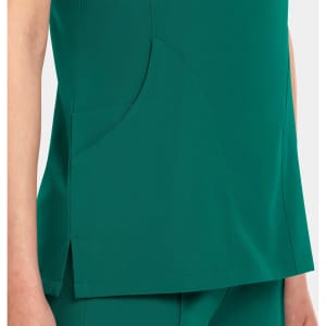 A women's v-neck top in a rich green colour, featuring a side pocket and a sleek design.