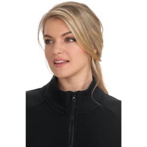 A black wellness jacket featuring a high collar and zip closure, worn by a model with long blonde hair.