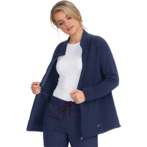 A navy blue wellness jacket featured on a model, showcasing a relaxed fit and a zippered front.