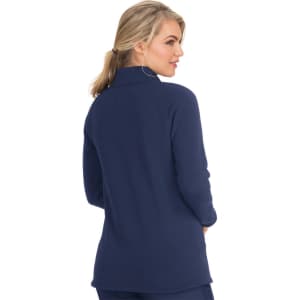 A navy blue wellness jacket featuring a high collar and long sleeves, shown from the back with a fitted silhouette.