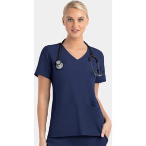 A women’s mock wrap top in navy blue with contrast panels and a stethoscope around the neck.