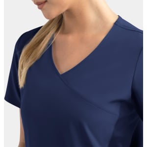 A navy mock wrap top with a v-neck and short sleeves, featuring contrast panels. It includes a logo.