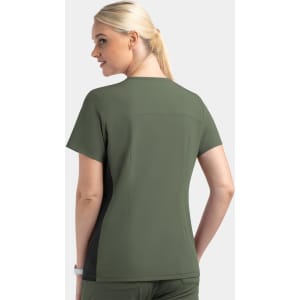 A women's mock wrap top featuring contrast panels in green tones, showcasing a relaxed fit and short sleeves.
