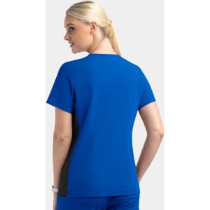 A women's mock wrap top in royal blue with black contrast panels, featuring a sleek, modern design and a logo.