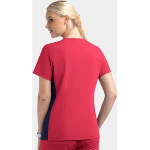 A women’s mock wrap top featuring contrast panels in red and navy. The top has a relaxed fit and short sleeves.
