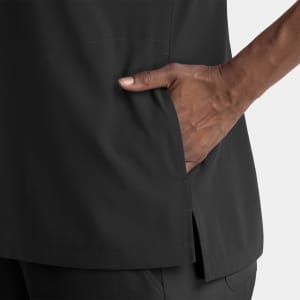A black women's dolman top featuring a notched neck and side pockets, designed for comfort and style.