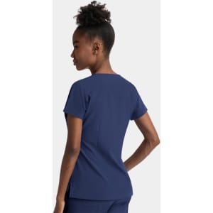 A women's navy notched neck dolman top, featuring short sleeves and a relaxed fit. The top has a logo on it.