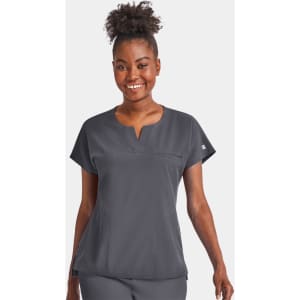A women's grey notched neck dolman top featuring short sleeves and a chest pocket. The top has a branding logo.