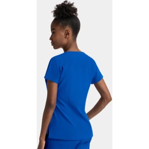A blue women's notched neck dolman top with short sleeves and a fitted design. The model is shown from the back.