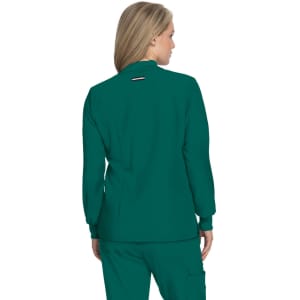 A teal jacket with long sleeves and a high collar, featuring a small logo at the back.