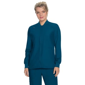 A teal jacket with a zip front, featuring a round neckline and two front pockets, worn by a model.