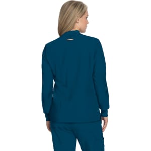 A teal jacket with long sleeves and a back slit, featuring a logo on the back.