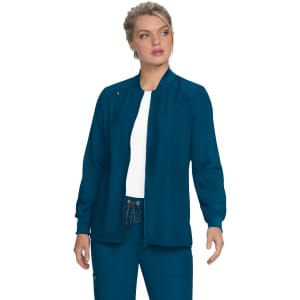 A teal jacket with a fitted neckline and long sleeves, displayed on a model wearing a white top and matching pants.