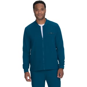 A teal jacket with a zip closure, featuring a logo, worn by a smiling model.