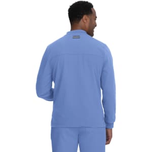 A man wearing a light blue jacket, viewed from the back, featuring a subtle logo on the neck.